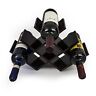 A wine rack with four bottles in it.