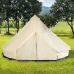 A white tent in a grassy area.