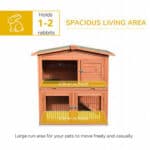 An image of a rabbit hutch with the words spacious living area.