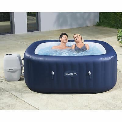 An inflatable hot tub with two people in it.