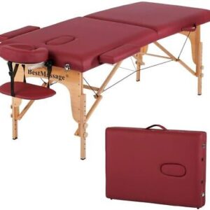 A massage table with a red cover and a case.
