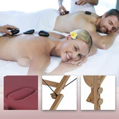 A man and woman are having a massage on a massage table.