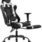 A black and white gaming chair with a footrest.