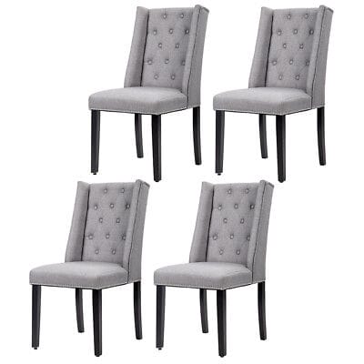 A set of four gray dining chairs with black legs.