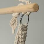 A rope hanging from a wooden handle.