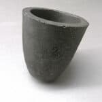 Cast iron laboratory mortar without pestle.