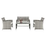 Outdoor furniture set consisting of a table and four chairs with wicker design and plush cushions.