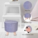 A small, purple faux fur ottoman with wooden legs and felt protector pads.