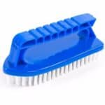 Blue plastic scrubbing brush with white bristles on a white background.