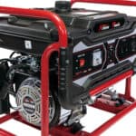 Portable gasoline generator with a red frame and control panel.