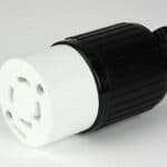 Black and white power plug adapter against a gray background.