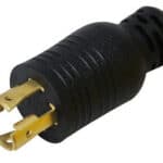 Close-up of a yellow and black 3-prong electrical plug.