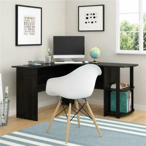 A neat home office setup with a black desk, white chair, and decorative elements near a window.