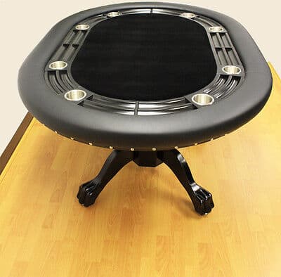 Round black poker table with cup holders on a wooden floor.