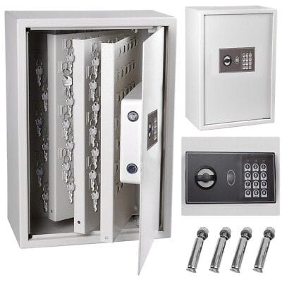 A white safe box with keys and other items.