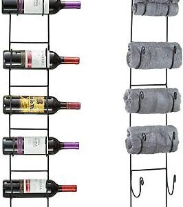 A wine rack with towels and wine bottles.