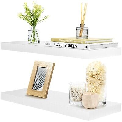 A shelf with flowers and objects on it.