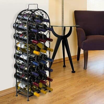A wine rack with a lot of bottles in it.