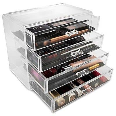 A clear acrylic makeup organizer with several drawers.