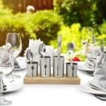 A table setting with silverware and napkins.