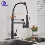 A kitchen sink with a black faucet.