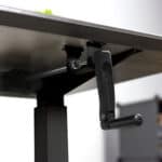 A black table with a handle attached to it.