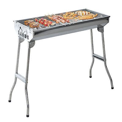 A bbq grill with a variety of food on it.