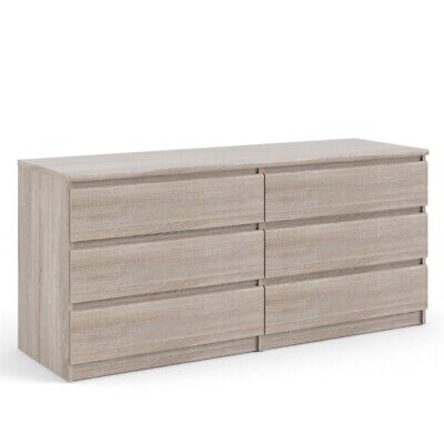 A dresser with four drawers on a white background.