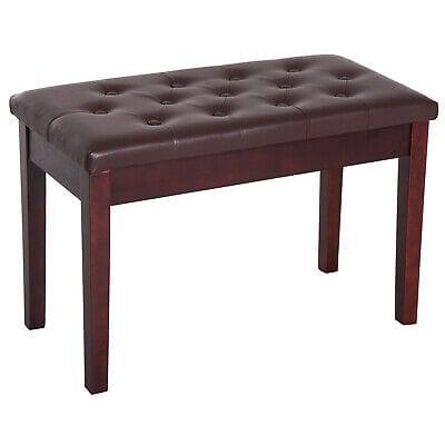 A wooden bench with a tufted upholstered seat.