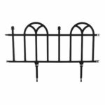 A black metal fence with two arches on it.