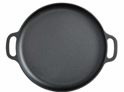A black oval cast iron pan on a white background.