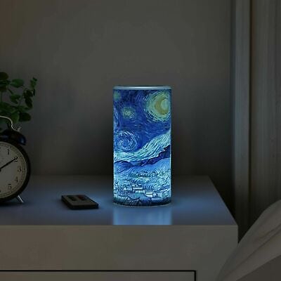 A night light with a starry night painting on it.