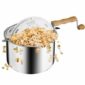 A pot of popcorn with a wooden handle.