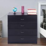 A chest of drawers in a bedroom with a globe on top.