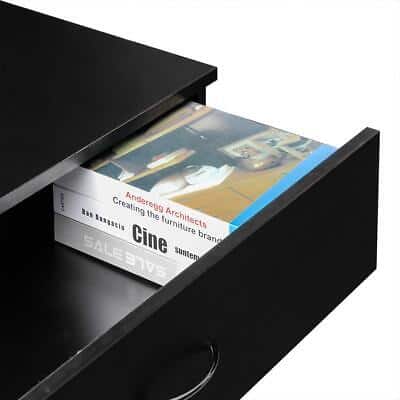 A black drawer with a book in it.