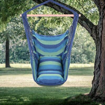 A blue and green hammock chair hanging from a tree.