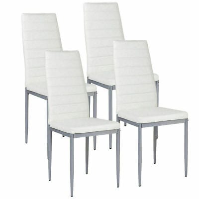 A set of four white dining chairs on a white background.