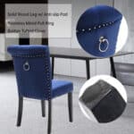 A blue velvet chair with a ring on it.