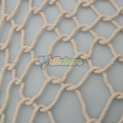 A close up of a rope net on a white surface.