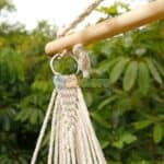 A rope hammock hanging from a tree.