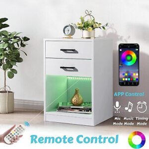 A nightstand with remote control and a remote.