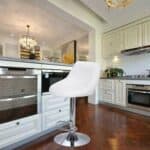 A white bar stool in a kitchen.