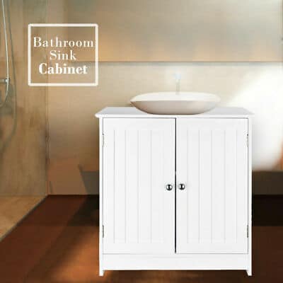 A bathroom sink cabinet with a white sink.