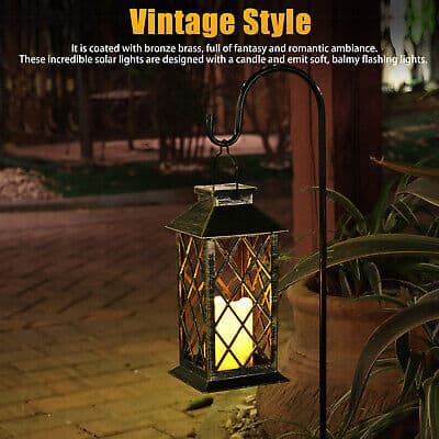 A vintage style lantern with a candle in it.