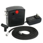 A portable air compressor with a hose and a plug.