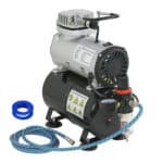 An air compressor with hose and hose.