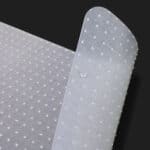 A white plastic sheet with dots on it.