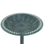 A green bird bath on a metal stand.