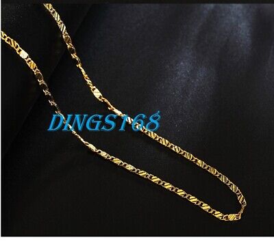 A gold chain on a black background.