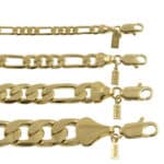 A set of gold - plated chain bracelets.